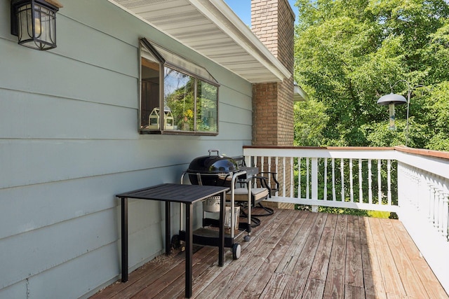 wooden terrace featuring area for grilling