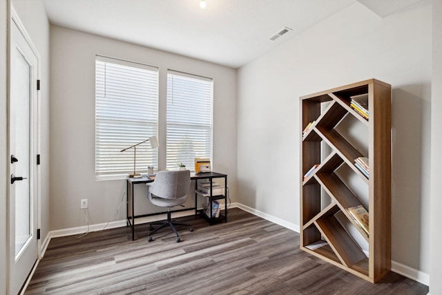 office with visible vents, baseboards, and wood finished floors