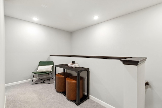 sitting room featuring carpet flooring, recessed lighting, and baseboards