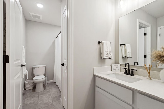 bathroom featuring vanity, baseboards, visible vents, curtained shower, and toilet