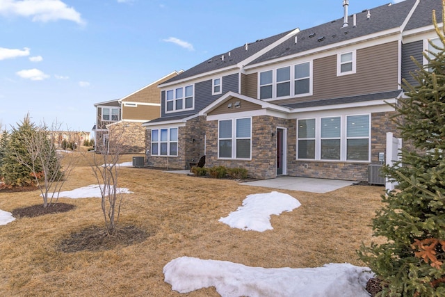 back of house with a patio, a yard, central AC unit, and roof with shingles