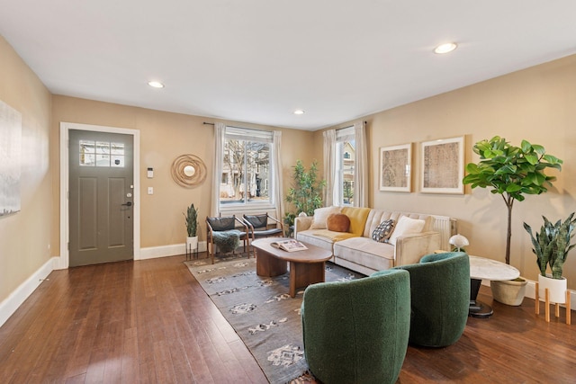 living room featuring recessed lighting, baseboards, and hardwood / wood-style flooring