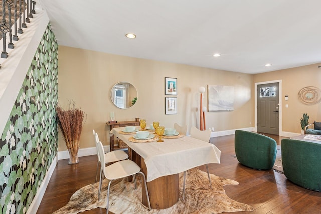 dining room with recessed lighting, baseboards, stairs, and hardwood / wood-style flooring