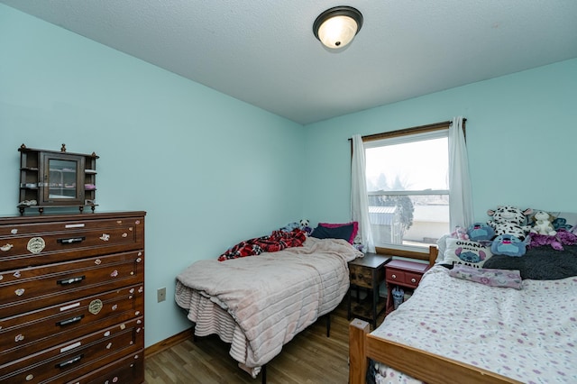 bedroom featuring wood finished floors