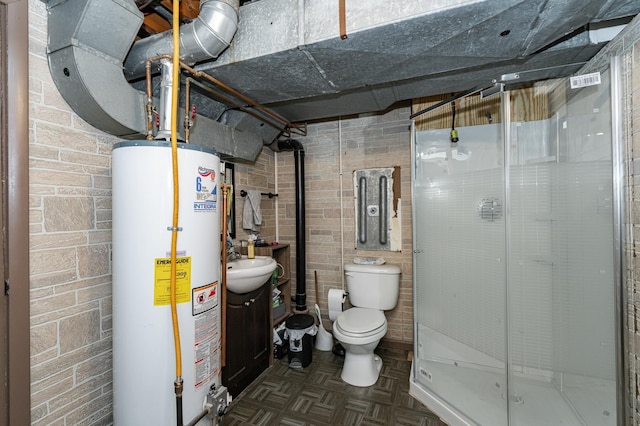 bathroom with vanity, toilet, water heater, and a stall shower