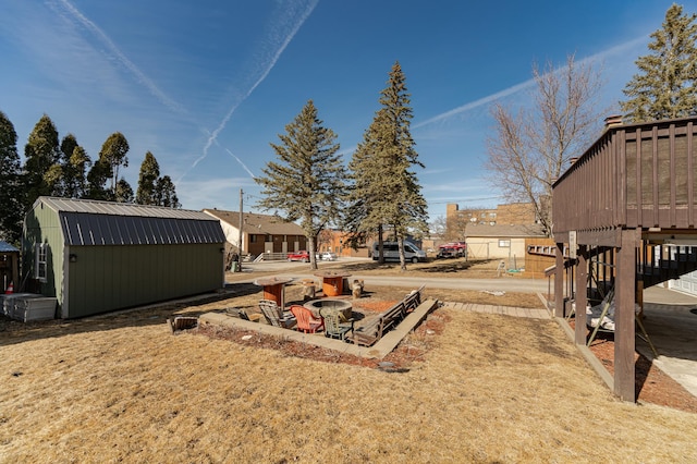 view of yard with an outbuilding and a storage shed