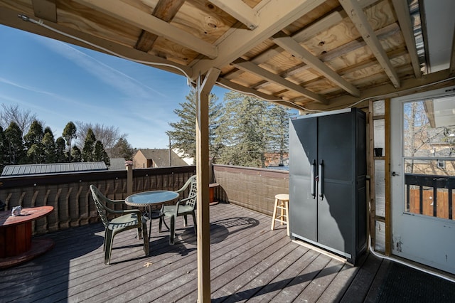 wooden deck with outdoor dining area