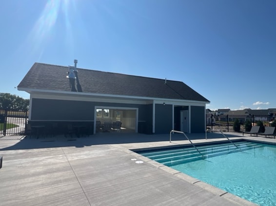 pool featuring a patio area and fence