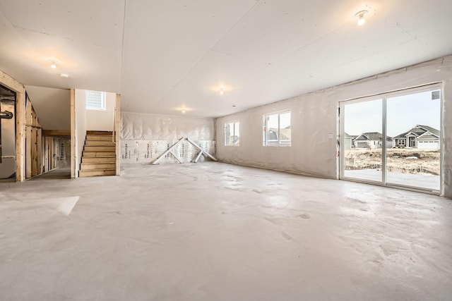 basement featuring stairs