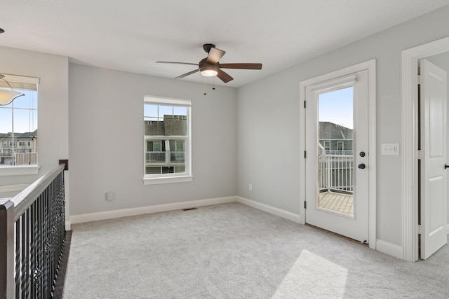 unfurnished room with ceiling fan, baseboards, and carpet floors