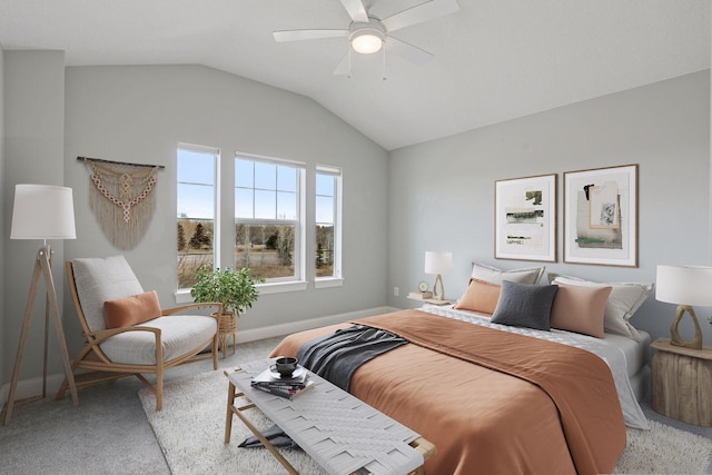 bedroom featuring ceiling fan, lofted ceiling, baseboards, and light carpet