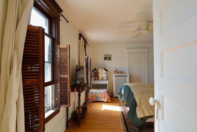 bedroom featuring ceiling fan and light wood-style floors