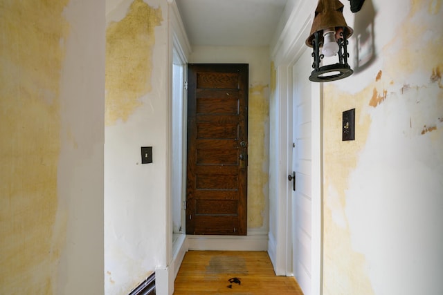 hallway with wood finished floors