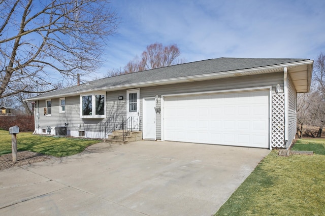 single story home featuring a front yard, driveway, an attached garage, a shingled roof, and central air condition unit