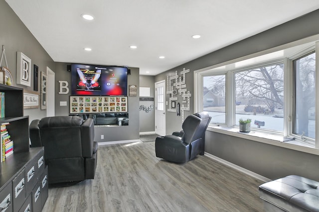 sitting room featuring recessed lighting, baseboards, and wood finished floors