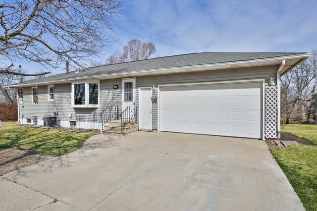 ranch-style house with central air condition unit, a front lawn, concrete driveway, a shingled roof, and a garage