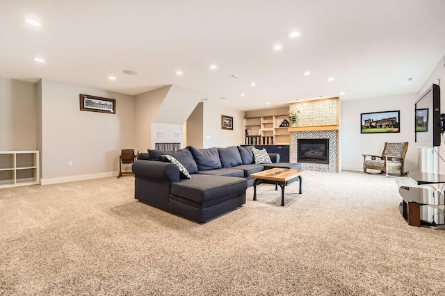 living area featuring recessed lighting, light colored carpet, and baseboards