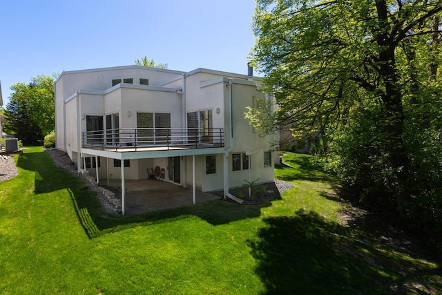 3520 Fairway Ln, Minnetonka, MN 55305 - rear view of property featuring a patio area, a lawn, cooling unit, and stucco siding