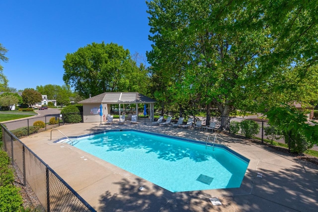 3520 Fairway Ln, Minnetonka, MN 55305 - community pool with fence, a patio, and view of wooded area
