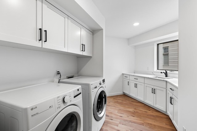 3520 Fairway Ln, Minnetonka, MN 55305 - clothes washing area with washing machine and dryer, cabinet space, recessed lighting, light wood-type flooring, and baseboards
