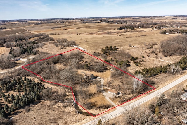 birds eye view of property with a rural view