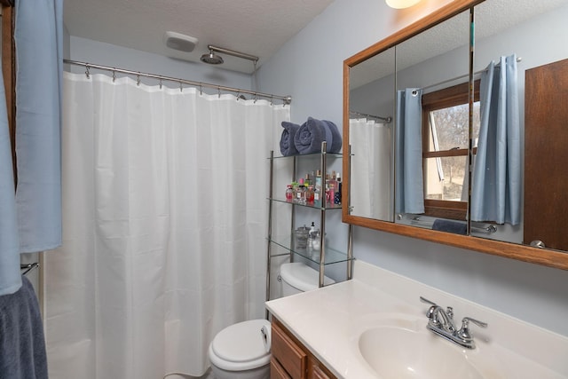 full bathroom with vanity, toilet, a shower with curtain, and a textured ceiling