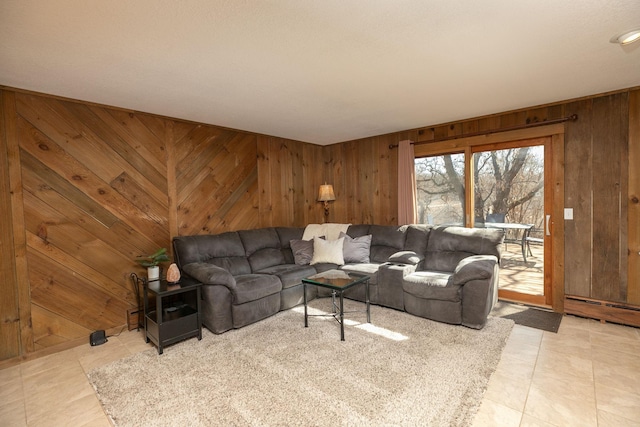 living area featuring light tile patterned floors and wooden walls