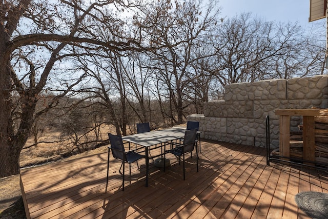 wooden deck featuring outdoor dining space