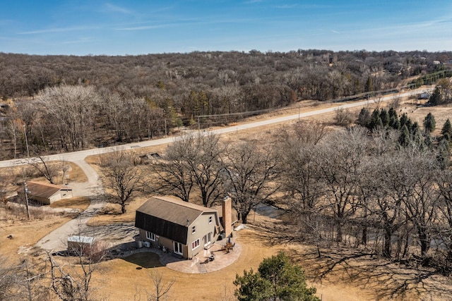 aerial view with a wooded view