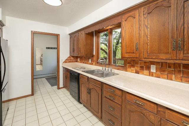 809 60th Ave SW, Rochester, MN 55902 - kitchen featuring black dishwasher, a sink, a baseboard heating unit, backsplash, and light countertops