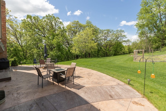 809 60th Ave SW, Rochester, MN 55902 - view of patio with outdoor dining space and view of scattered trees