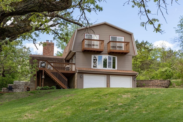 809 60th Ave SW, Rochester, MN 55902 - back of house with a balcony, stairway, a lawn, a garage, and a gambrel roof