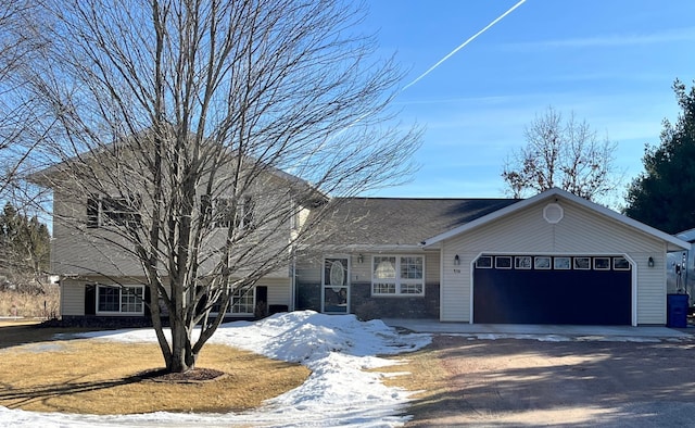 view of front of home with a garage and driveway