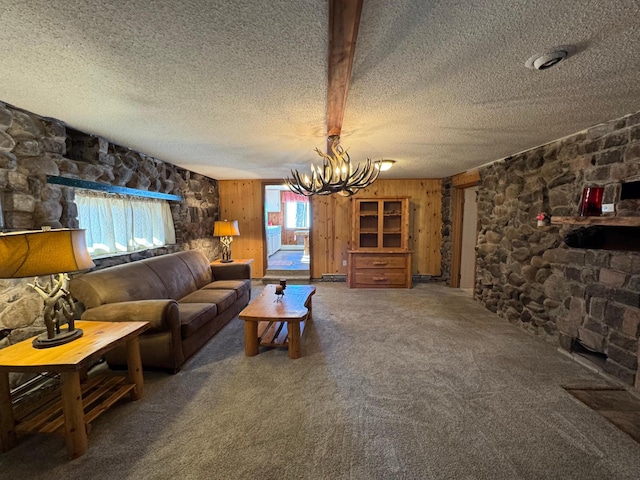 20455 326th Ave, Isle, MN 56342 - living room featuring a chandelier, carpet, a textured ceiling, and wooden walls
