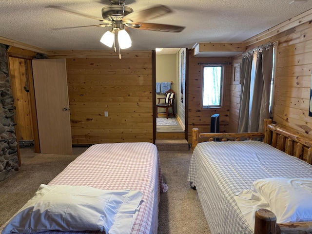 20455 326th Ave, Isle, MN 56342 - carpeted bedroom featuring wood walls, a textured ceiling, and a ceiling fan