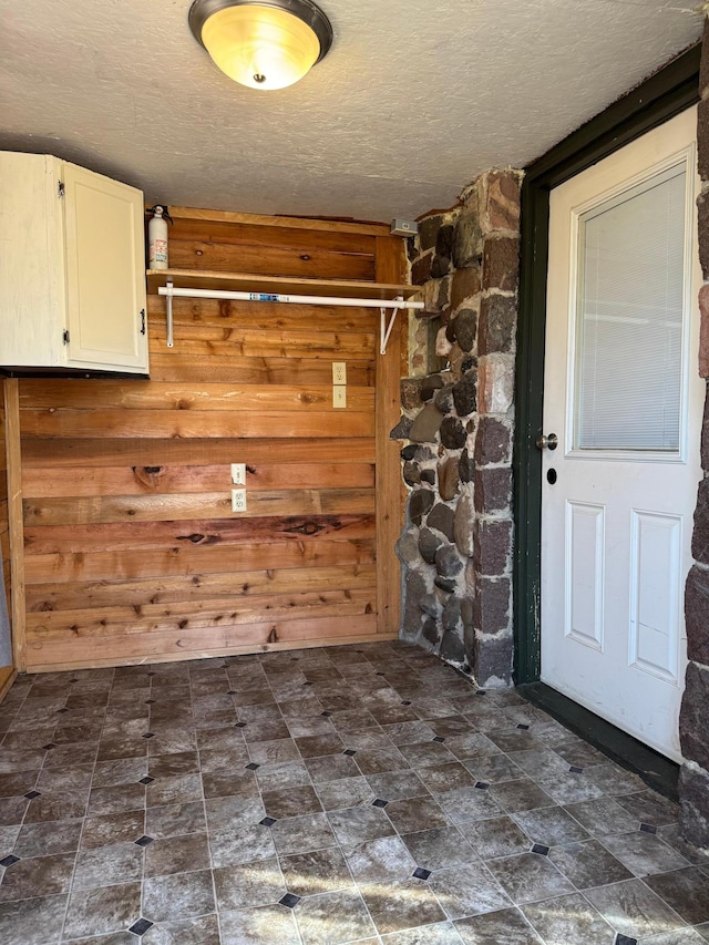 20455 326th Ave, Isle, MN 56342 - washroom featuring a textured ceiling and wood walls