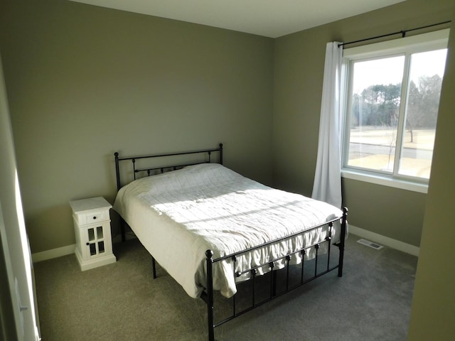 bedroom with visible vents, baseboards, and carpet floors