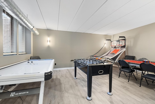 game room with wood finished floors and baseboards