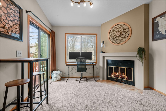 office space featuring baseboards, carpet floors, and a fireplace with flush hearth