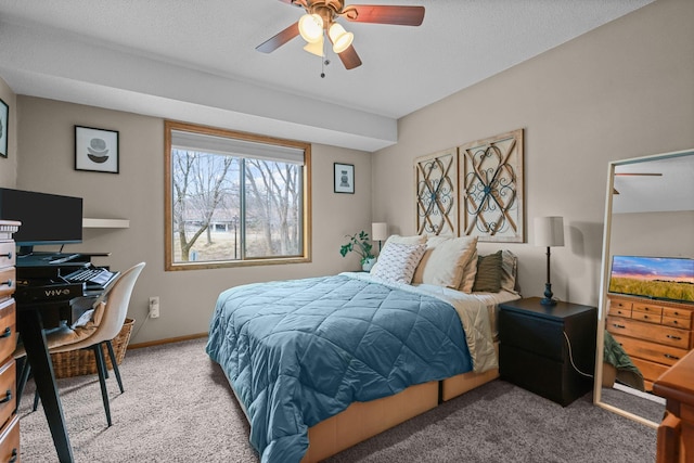 carpeted bedroom with baseboards and ceiling fan