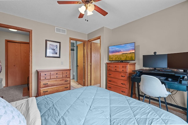 bedroom featuring carpet, visible vents, and ceiling fan