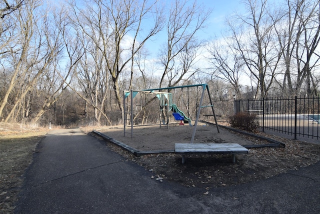 communal playground featuring fence