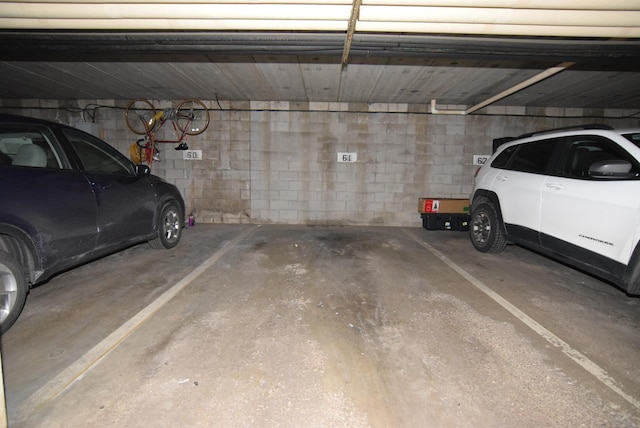 garage featuring concrete block wall