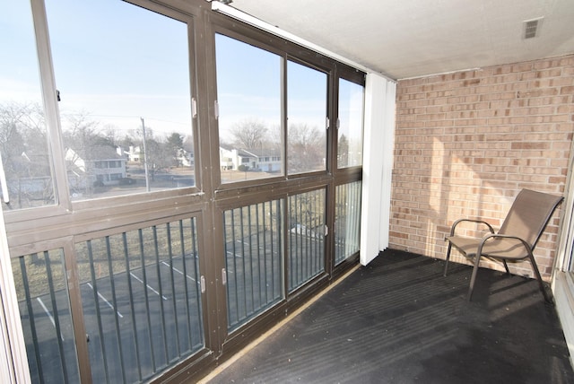 unfurnished sunroom with visible vents