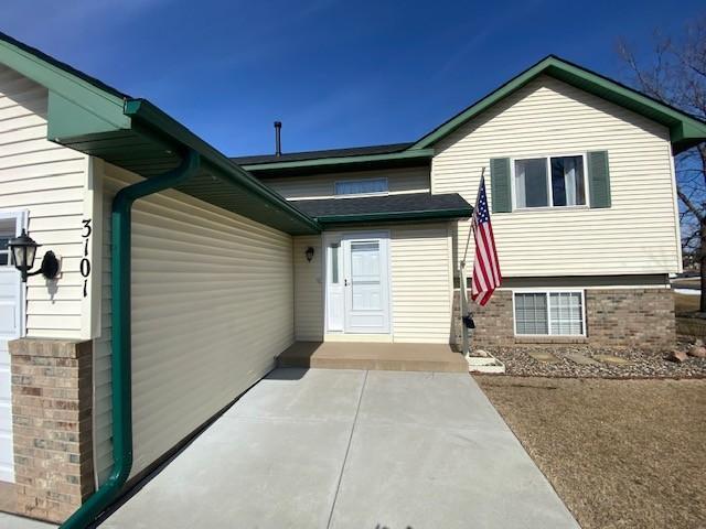 exterior space featuring brick siding