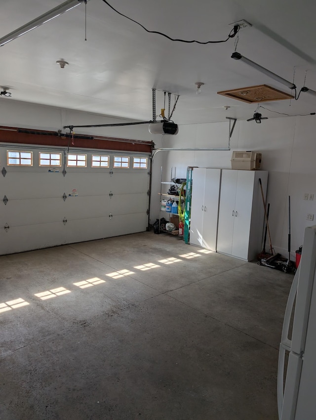 garage featuring a garage door opener