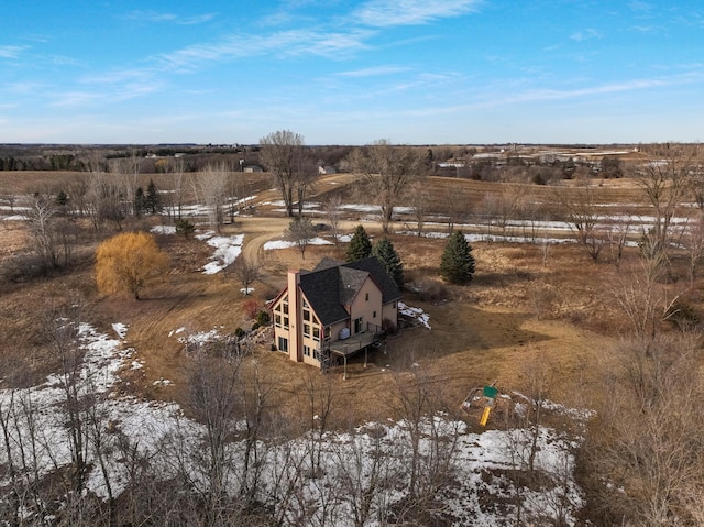 snowy aerial view featuring a rural view