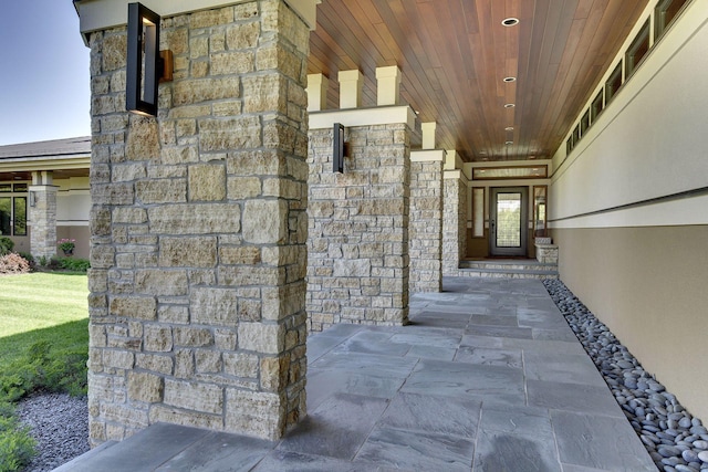 exterior space with stone siding