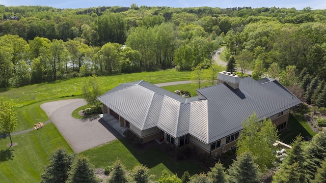 drone / aerial view featuring a view of trees