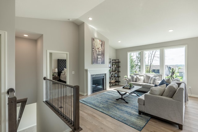 9176 62nd St S, Cottage Grove, MN 55016 - living room featuring lofted ceiling, a high end fireplace, light wood-style flooring, and recessed lighting